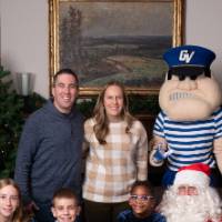 Family of five with Santa and Louie the Laker.